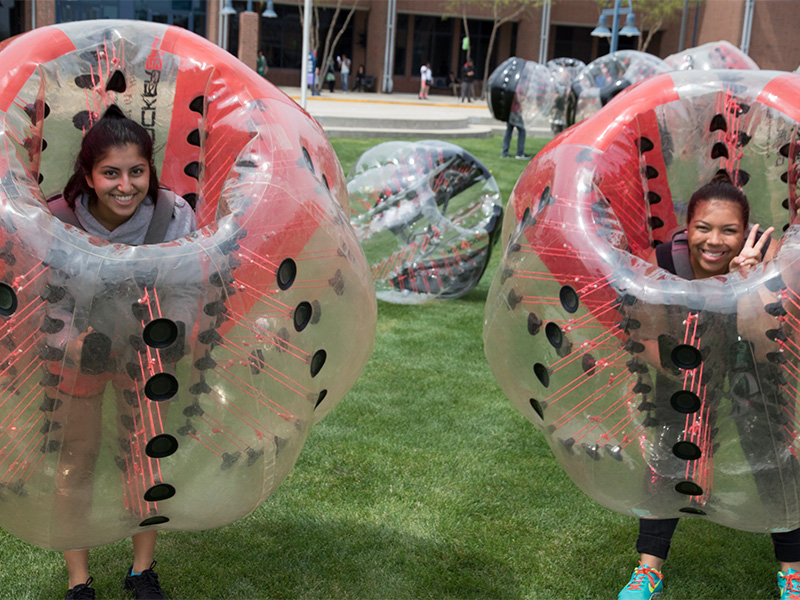 Students inside of an inflatable ball. 