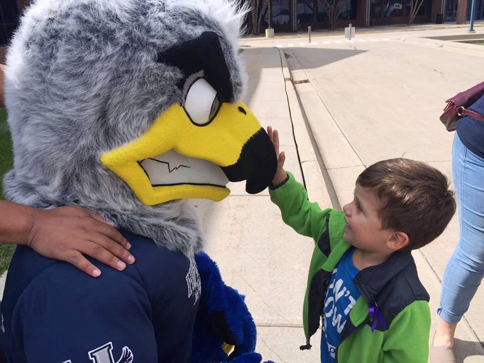 Kid touching Hunter's nose