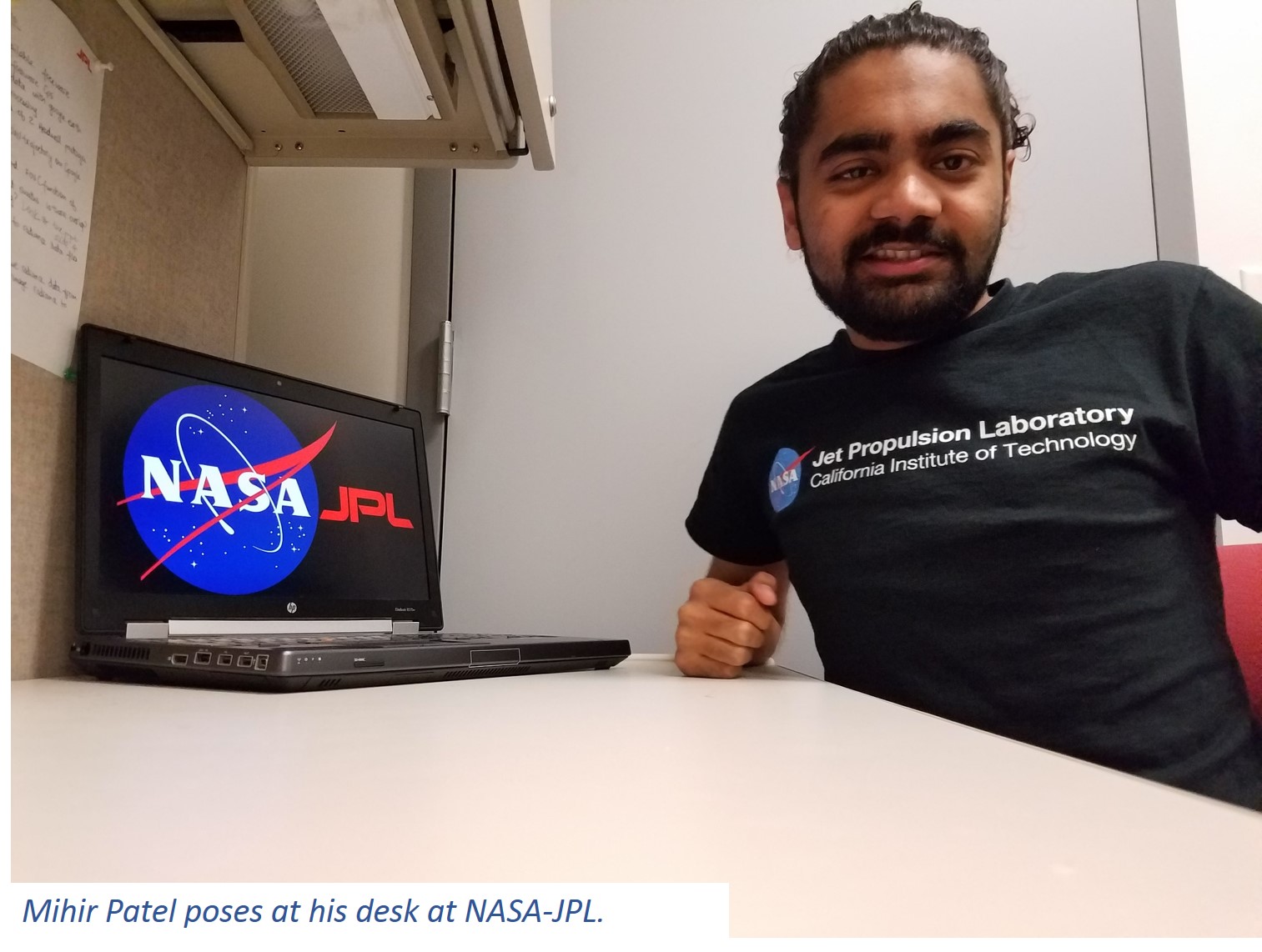Mihir Patel poses at his desk at NASA-JPL