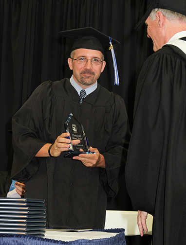 John Bierbaum receives the Distinguished Alumni Award in 2015.