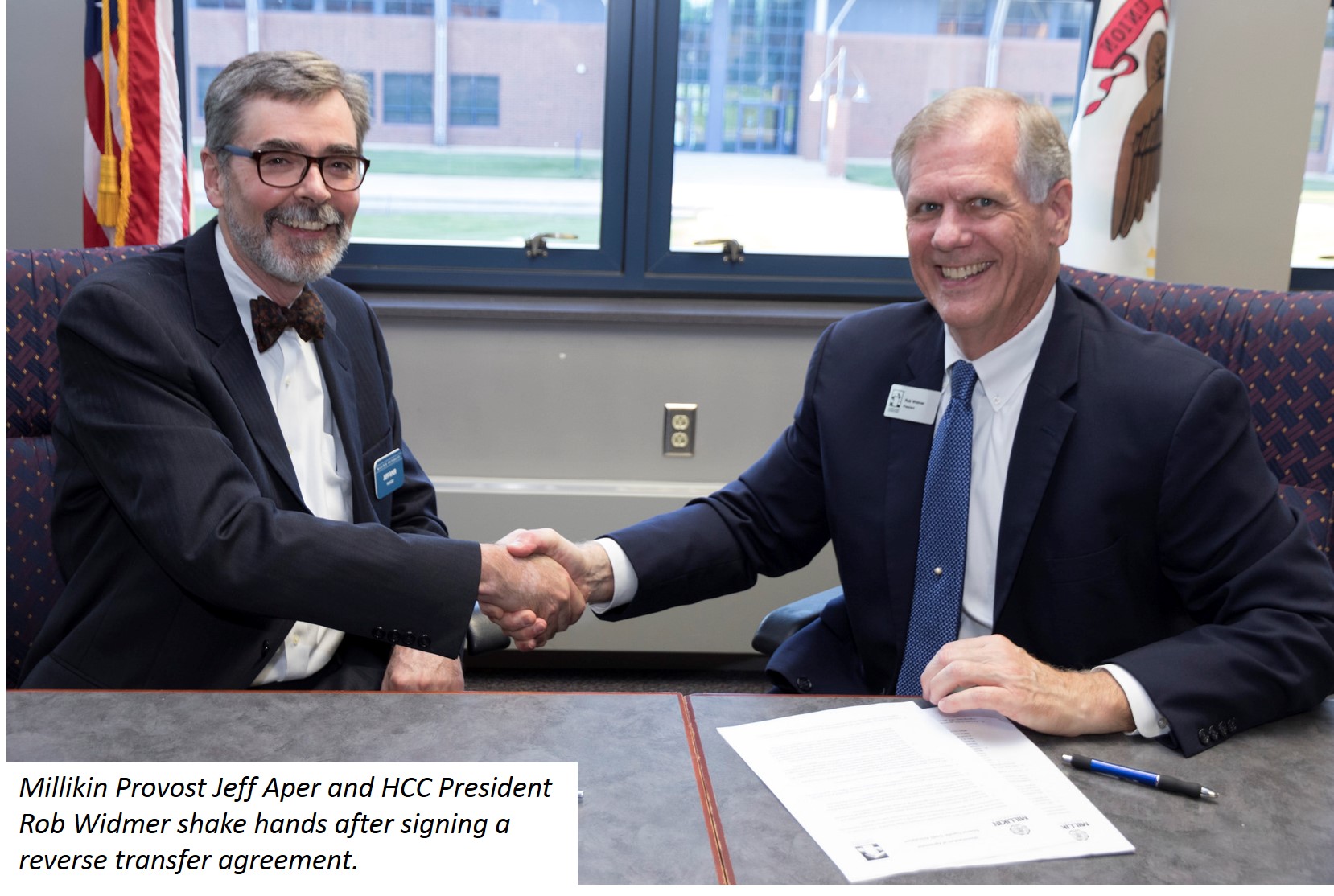 Jeff Aper and Rob Widmer shake hands